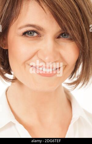 Studio shot of beautiful adult woman smiling at camera Stock Photo