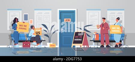 mix race hr managers holding we are hiring join us posters vacancy open recruitment human resources concept office corridor interior horizontal full length vector illustration Stock Vector