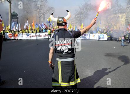 Firefighters march during a demonstration of French firemen against staff reduction in Paris, France, on March 14, 2017. Photo by Alain Apaydin/ABACAPRESS.COM Stock Photo