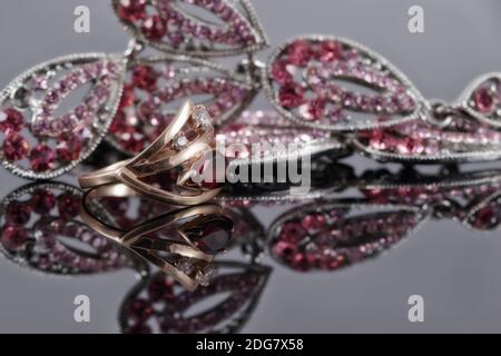 Gold ring with a ruby in the background of fashion jewelry Stock Photo