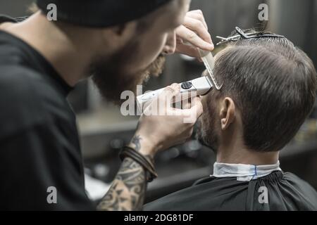 Doing haircut in barbershop Stock Photo