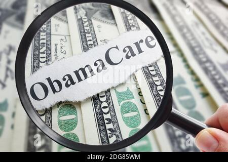 Obamacare and magnifying glass Stock Photo