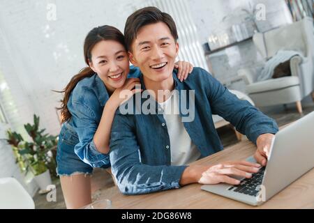 Happy young couples home office Stock Photo