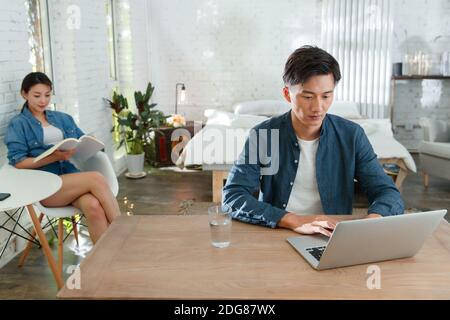 Young couples enjoy leisure time in the bedroom Stock Photo