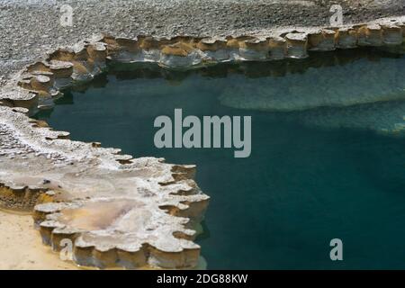 Colorful geothermal feature, Doublet Pool with scalloped geyserite deposits of opaline silica around the border, water about 190○f rare short eruption