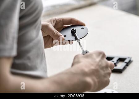 Man using screwdriver in workshop Stock Photo