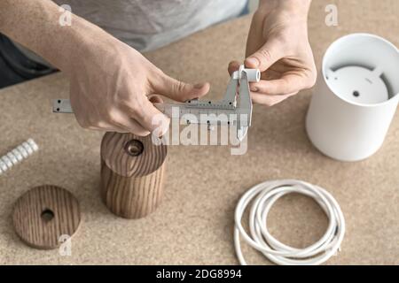 Man using caliper in workshop Stock Photo