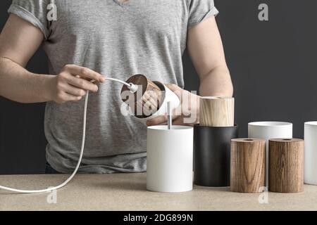 Assembling of lamp in workshop Stock Photo