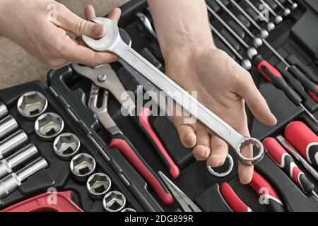 Open toolbox and male hands Stock Photo