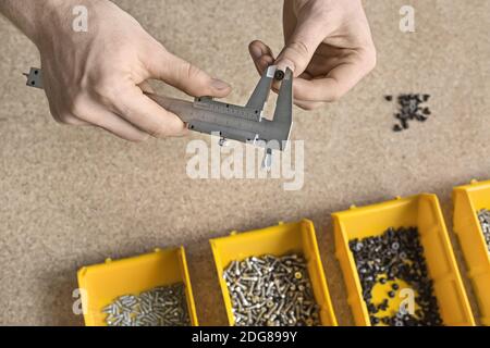 Man using caliper in workshop Stock Photo