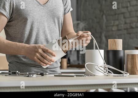Assembling of lamp in workshop Stock Photo