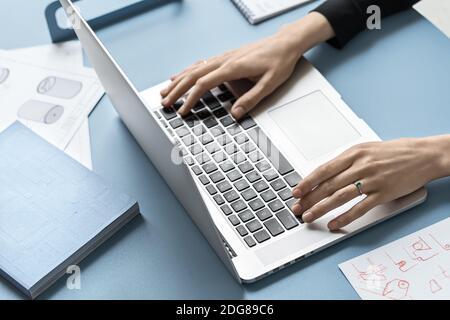 Girl using laptop in office Stock Photo