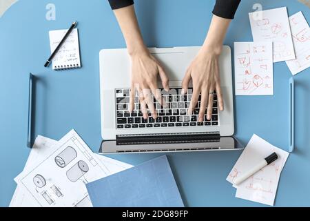 Girl using laptop in office Stock Photo