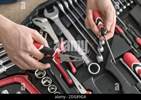 Open toolbox and male hands Stock Photo