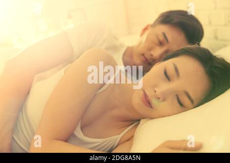 The young couple in bed Stock Photo
