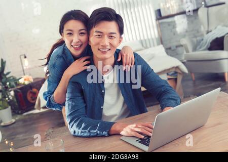 Happy young couples home office Stock Photo