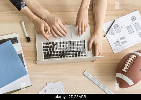 Man and woman using laptop in office Stock Photo