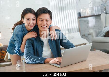 Happy young couples home office Stock Photo