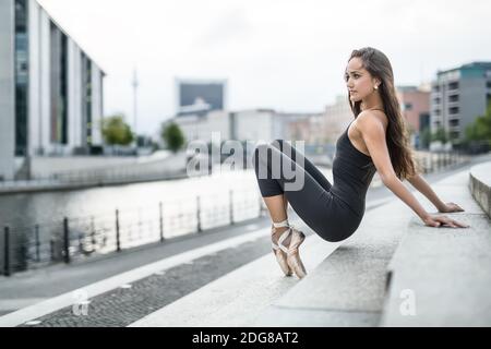 Attractive ballerina posing outdoors Stock Photo