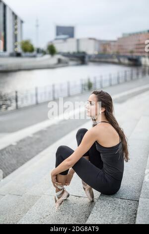 Attractive ballerina posing outdoors Stock Photo