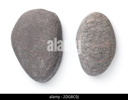 Two dark grey stones isolated over white background. Top view Stock Photo