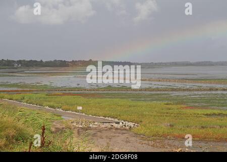 Rainbow over the mudflat, Keitum, Germany Stock Photo