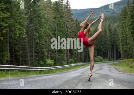 Ballerina posing outdoors Stock Photo