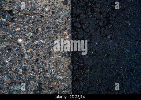 Junction point between old and new asphalt on a road.  Stock Photo