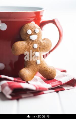 Xmas gingerbread man on checkered napkin. Stock Photo