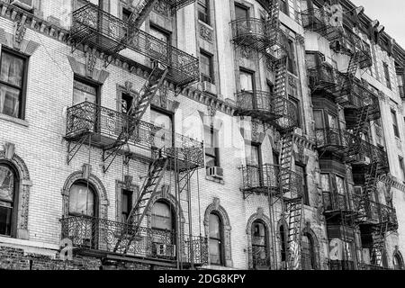 Fire escapes on buildings in Manhattan in black and white Stock Photo