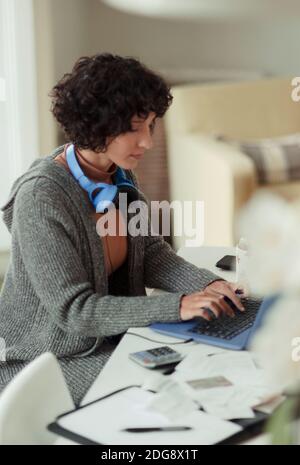 Woman working from home at laptop Stock Photo