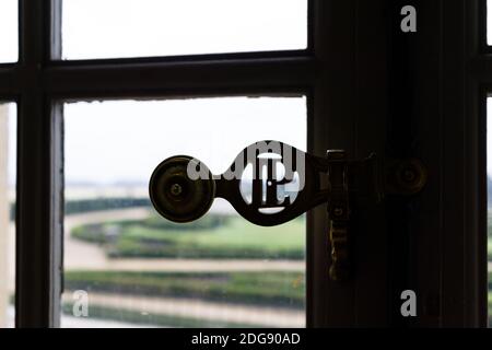 PARIS, FRANCE - Dec 06, 2018: A silhouette of a Window opener close up shot in the versailles palace, Paris, France Stock Photo