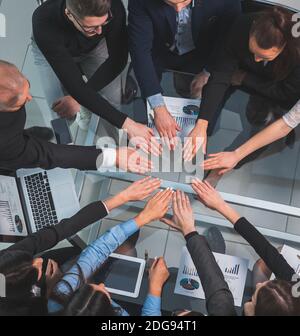 top view. business team joining their hands in a circle Stock Photo