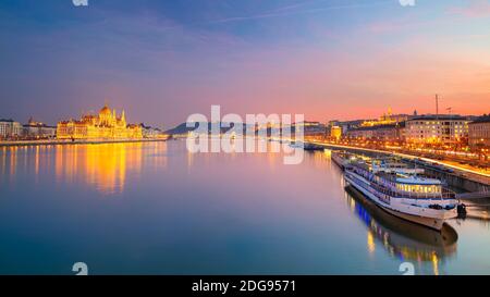 Budapest, Hungary. Panoramic cityscape image of Budapest, capital city of Hungary with Hungarian Parliament Building during beautiful sunset.