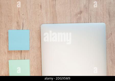 close up. sticky notes and a white laptop on the table. Stock Photo