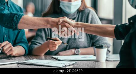 close up. business colleagues shaking hands with each other. Stock Photo