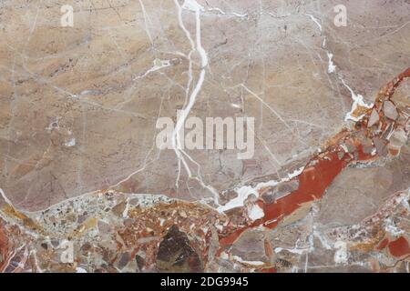 Variegated stone in gray, white and brown colors texture background with white veins Stock Photo