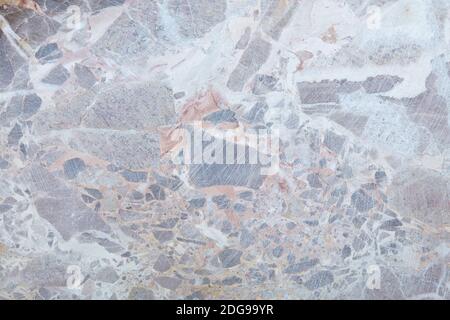 Variegated stone in gray, white and brown colors texture background Stock Photo