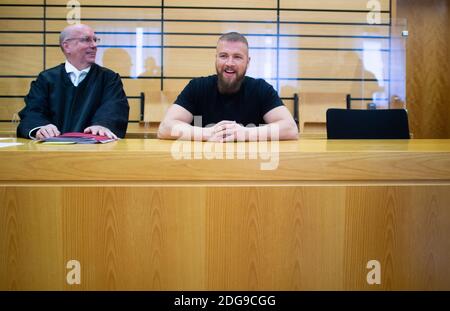 Viersen, Germany. 08th Dec, 2020. The rapper Kollegah (r), whose civil name is Felix Blume, sits next to his lawyer Christof Miseré at the local court. Blume is on trial for illegal possession of firearms. Credit: Jonas Güttler/dpa/Alamy Live News Stock Photo