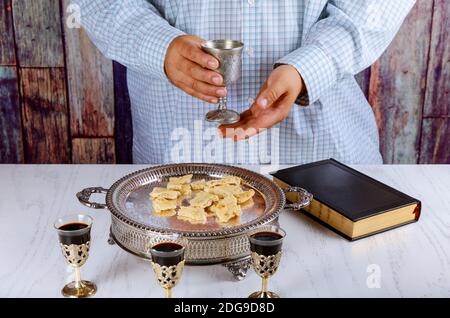 Bread, wine and bible for sacrament communion, prayer for wine Stock Photo