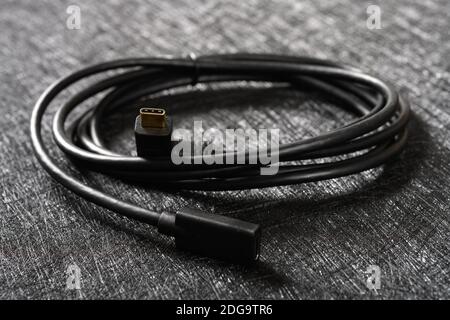 type C cable with male plug and female socket on a dark background Stock Photo