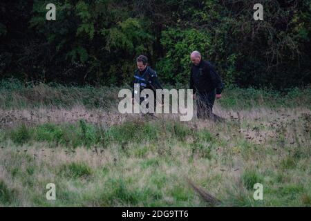 Specialist officers from West Midlands Police wading through the overgrowth on Newbold Comyn, where a woman's body was found Thursday 29th October. Anthony Russell, 38, was later charged with murder along with two others who were killed in Coventry earlier in the year. Stock Photo