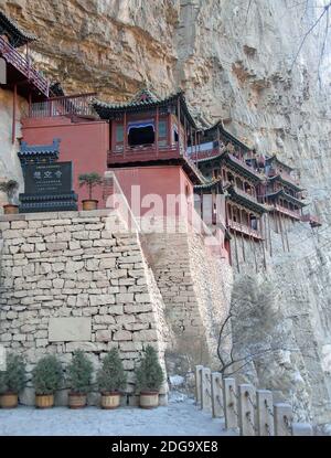 The Hanging Temple or Hanging Monastery near Datong in Shanxi Province, China. The temple with stone sign showing the name of the site. Stock Photo