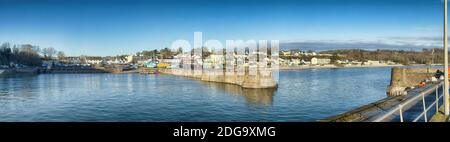 Panorama of Saundersfoot - harbour, town and beach - at high tide on a Winter day. Stock Photo