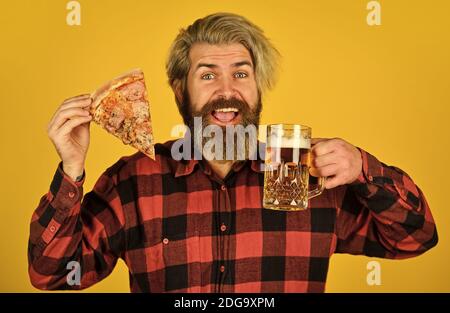 take-away pizza. Best party here. bachelor men club. Having fun and drink in bar. nice pub menu. man watching football while drinking beer and eating pizza. eating pizza and drinking. Stock Photo