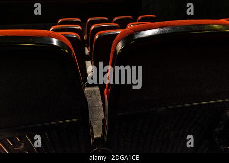 back view of empty red velvet seats in movie theater Stock Photo - Alamy