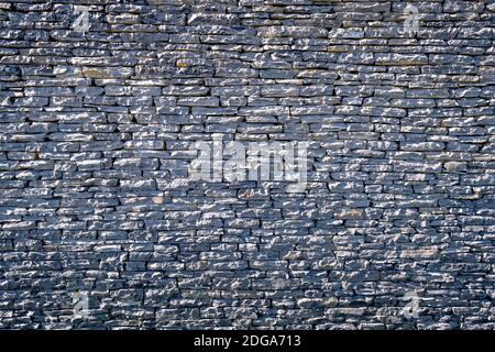 stone wall surface, Black brick wall texture, brick surface for background. Vintage wallpaper. Stock Photo