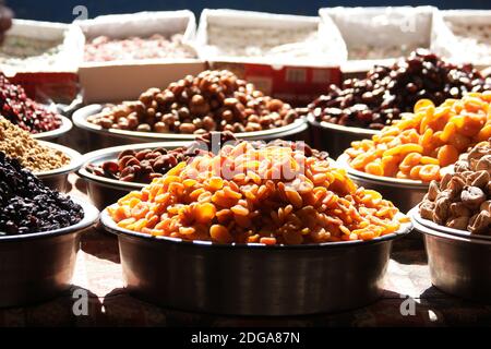 Dried fruits for sale on stall at farmers market. Stock Photo