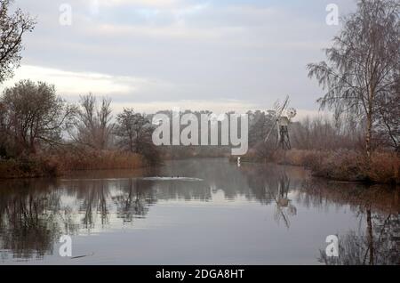 A view of the River Ant on a misty December morning on the Norfolk Broads by How Hill, Ludham, Norfolk, England, United Kingdom. Stock Photo