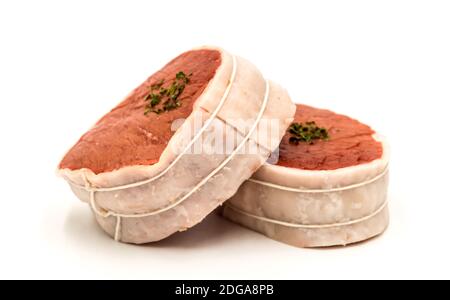 Tournedos: a small thick round cut from a fillet of beef on a white background Stock Photo